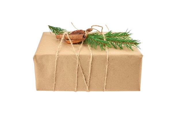 Christmas gift box decorated with fir tree branch and spices