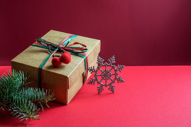 Christmas gift box and pine tree branch