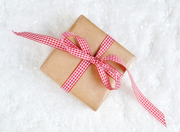 Christmas gift box on the snow