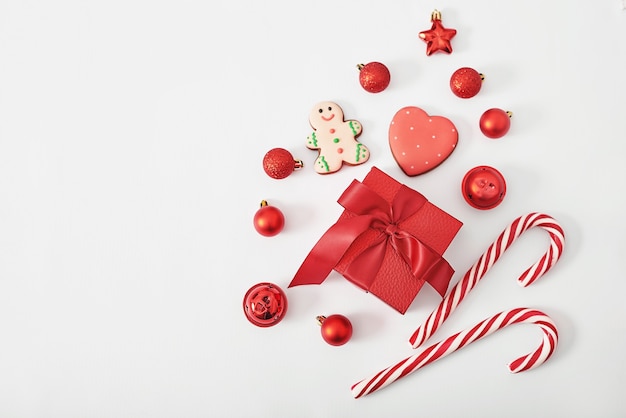 Christmas gift box with lollipops and toys isolated