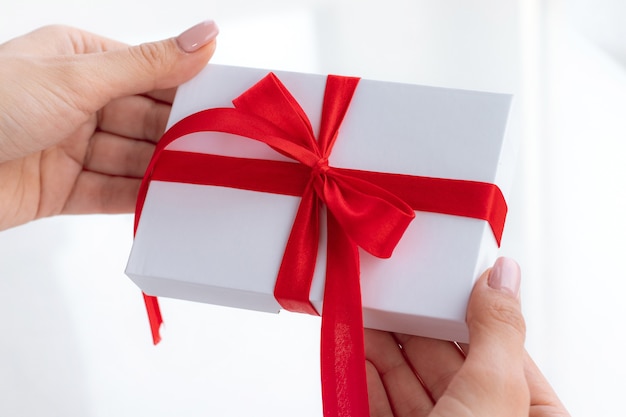 Christmas gift box with a red ribbon