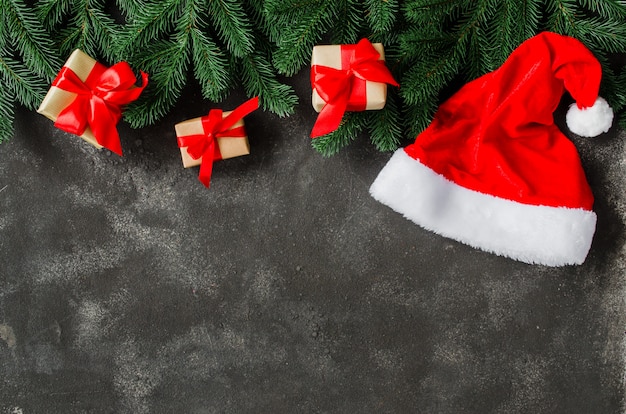 Christmas gift boxes and Santa Claus hat.