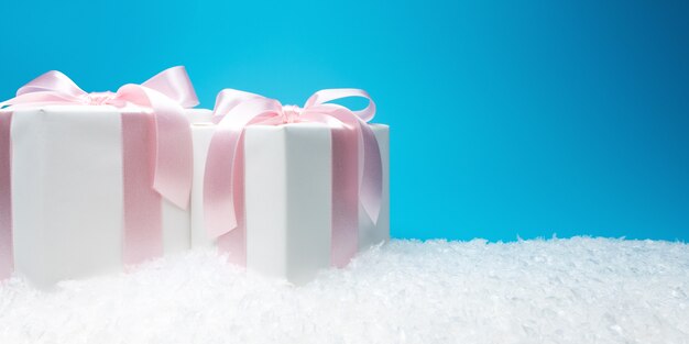 Christmas gift boxes with artificial snow