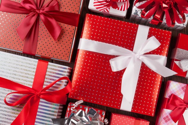 Christmas gift boxes on wooden table. Top view closeup