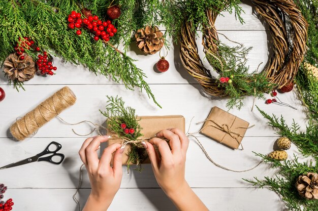 Christmas gift decoration with handmade diy on a white wooden background do it by yourself