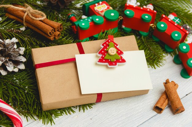 Christmas gift or present box wrapped in kraft paper on christmas decoration