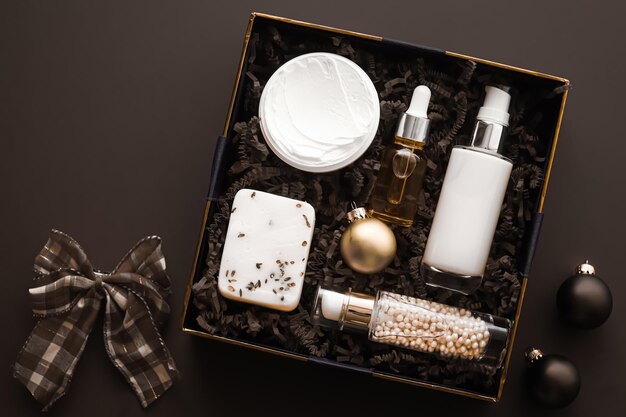 Christmas gift set xmas holidays beauty box subscription package and luxury skincare products flatlay cosmetic flat lay on dark background cosmetics as holiday present or shopping delivery