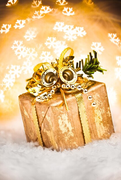 Christmas gift with Golden Holiday Background.