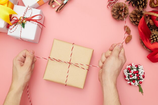 Christmas gift wrapping isolated on pink