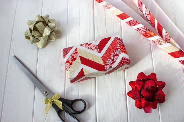 Christmas gift wrapping on white table