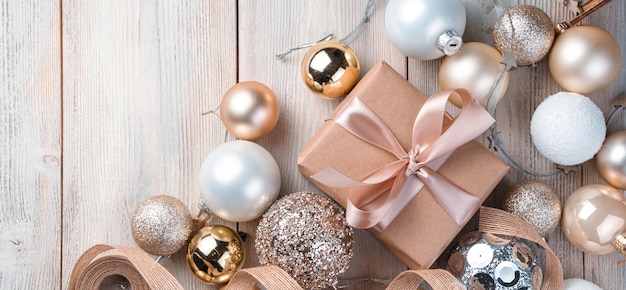 Christmas gifts and decorations on a beige background The concept of Christmas and New Year