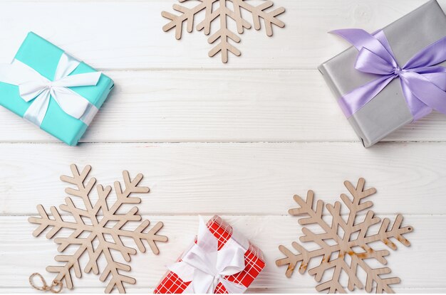 Christmas gifts and decorations on white wooden board