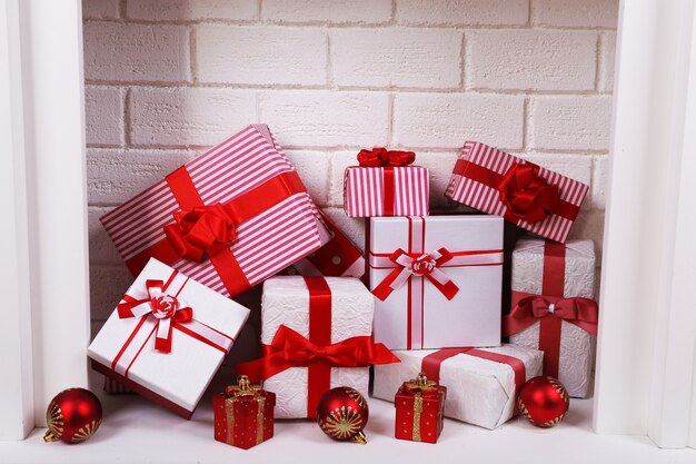 Christmas gifts in fireplace, close-up