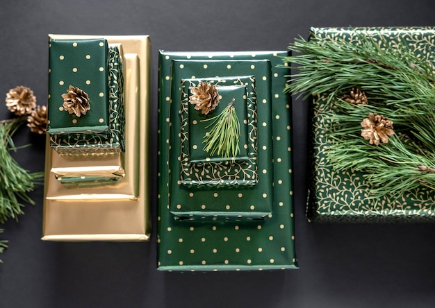 Christmas gifts in green and gold paper
