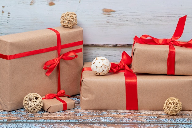 Christmas gifts and lights on wooden floor