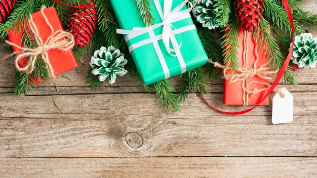 Christmas gifts on an old wooden table.