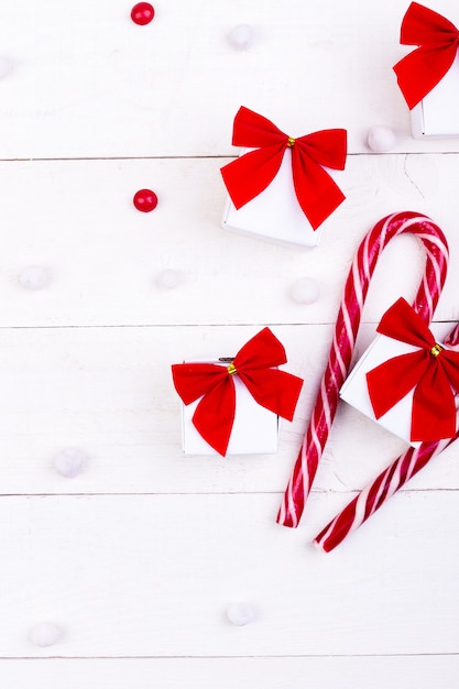 Christmas gifts, white little gift boxes with red bow 