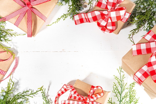 Christmas gifts on white wooden background