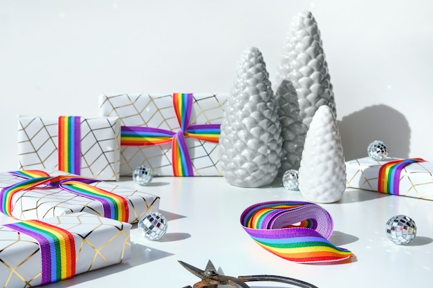 Christmas gifts with rainbow ribbon in LGBTQ community flag colors