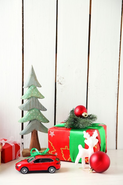 Christmas gifts on wooden background