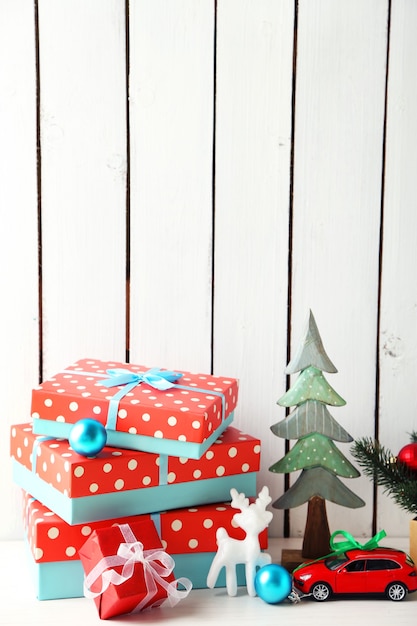 Christmas gifts on wooden surface