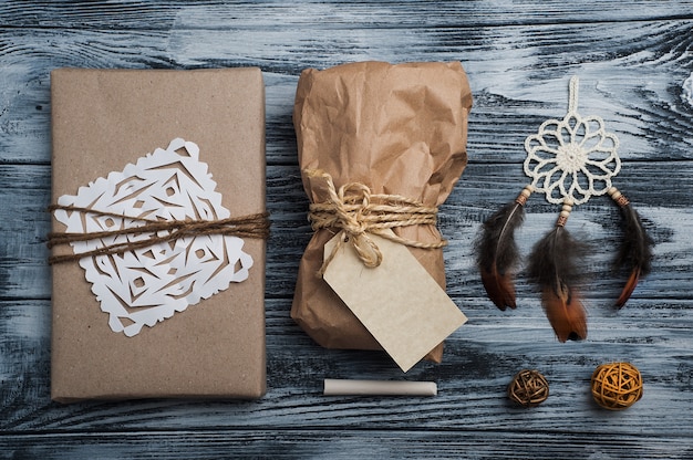 Christmas gifts on wooden table, top view