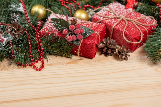 Christmas gifts wrapped in corrugated paper on wooden background