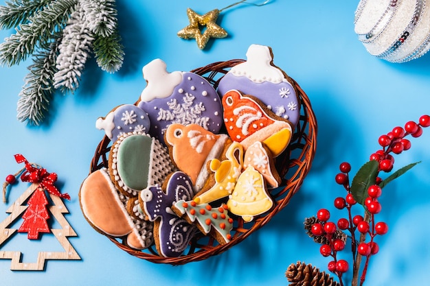 Christmas Gingerbread on blue background Flat lay