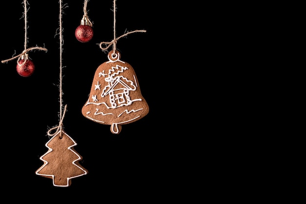 Christmas gingerbread cookies on a black surface