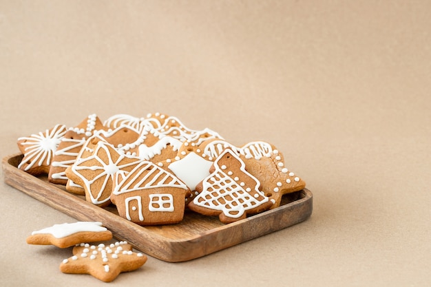 Christmas gingerbread cookies on brown background
