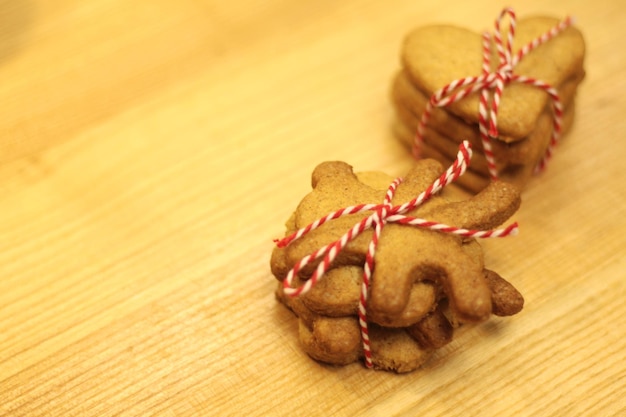 Christmas gingerbread cookies on a wooden background baking