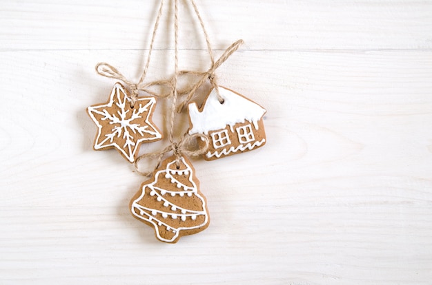 Christmas gingerbread of different kinds on a black and white wooden background