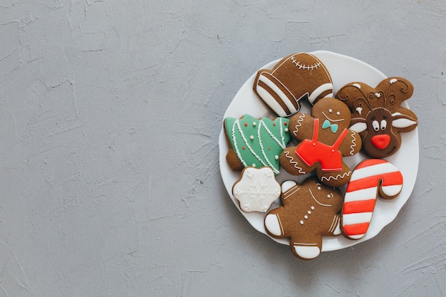 Christmas gingerbreads on a gray background.