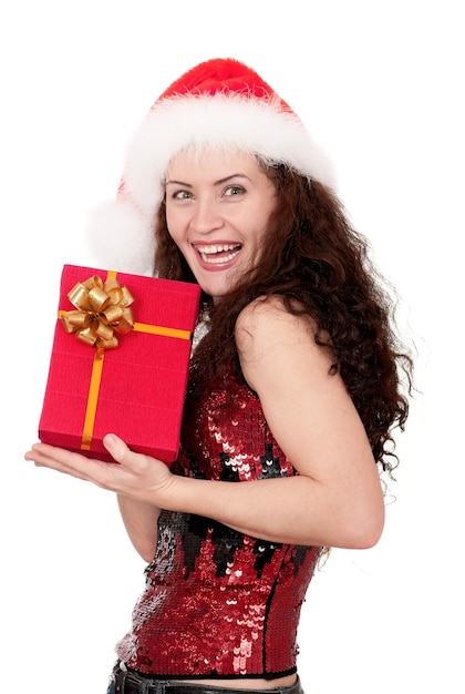 Christmas girl holding gift wearing Santa hat over white background