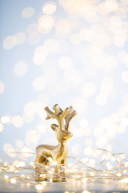 Christmas gold bokeh background with decorative star. Christmas gold stars. Christmas pattern. Background on the gray color. - Image