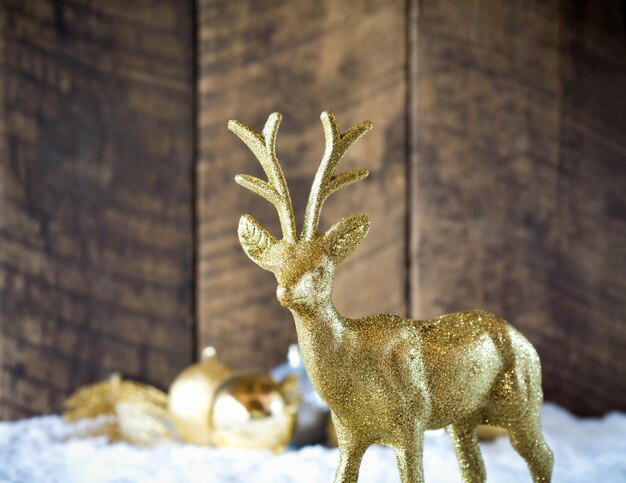 Christmas gold reindeer decoration with wood 