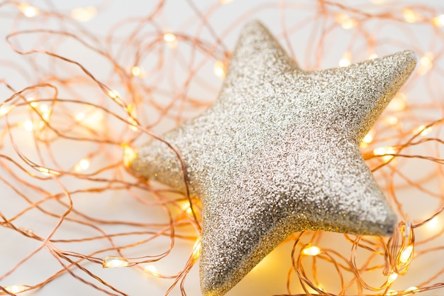 Christmas gold stars decoration on abstract background.