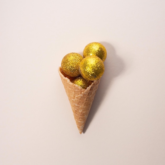 Christmas golden balls ice cream Minimal concept on beige background