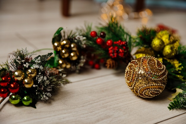 Christmas golden toy on a background of glowing lights