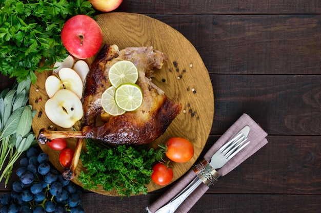 Christmas goose baked in the oven with apples and grapes