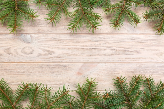 Christmas gray wooden surface with fir tree and copy space.