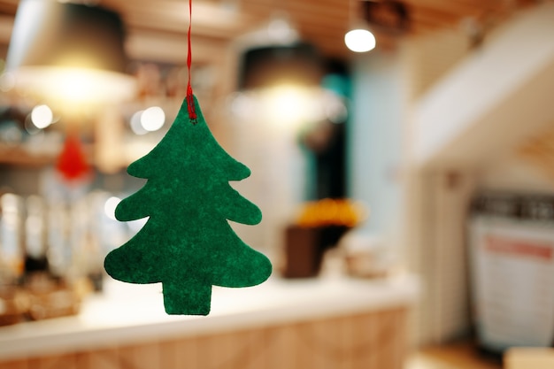 Christmas green felt tree concept of new year holidays christmas eve tradition fir tree on backgroun...