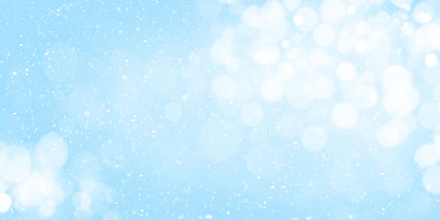 Christmas greeting card backdrop with snow frost over blue background with bokeh