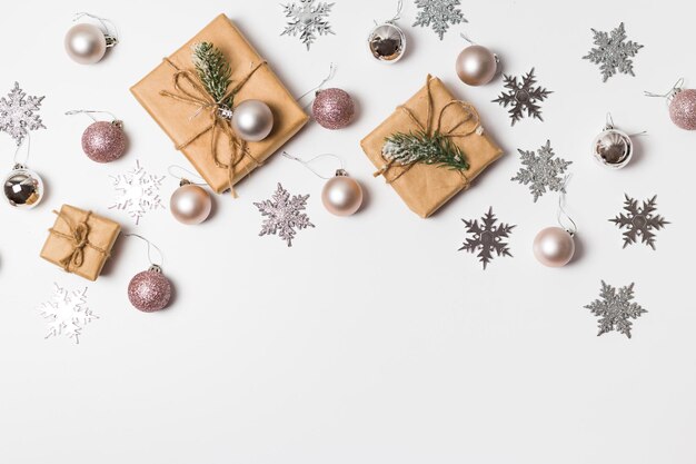 Christmas greeting card. Gift boxes and Christmas decorations layout on an isolated white background, top view. Flat lay.