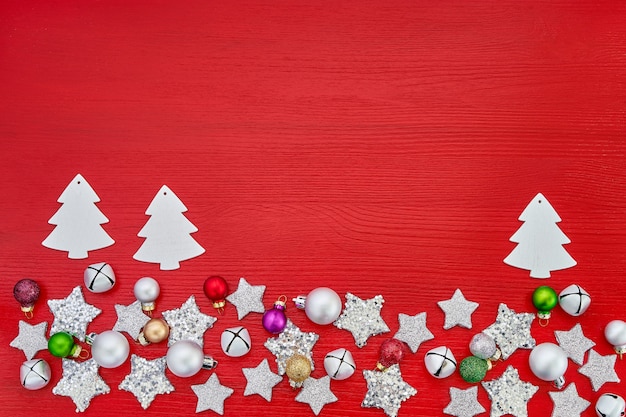 Christmas greeting card. White Christmas decoration on red background. Top view, .