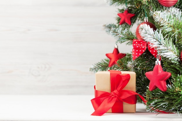 christmas greeting card with decorated fir tree gift box and copy space for your xmas greetings