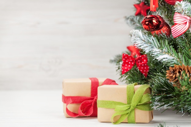 christmas greeting card with decorated fir tree gift boxes and copy space for your xmas greetings