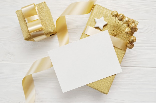 Christmas greeting card with golden gifts