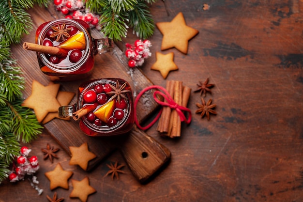 Christmas greeting card with mulled wine gingerbread cookies and xmas tree Top view flat lay with space for your greetings