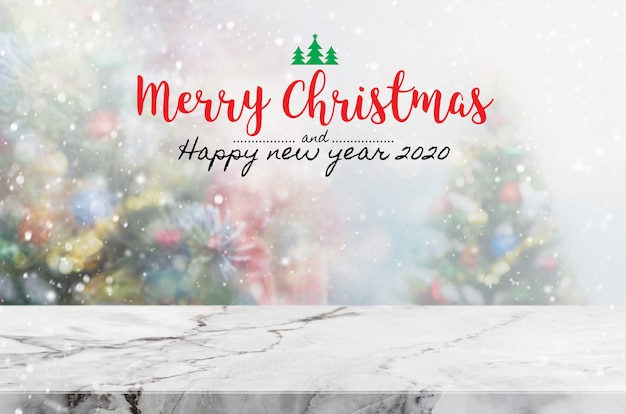 Christmas and Happy new year 2020 on empty marble stone table 
